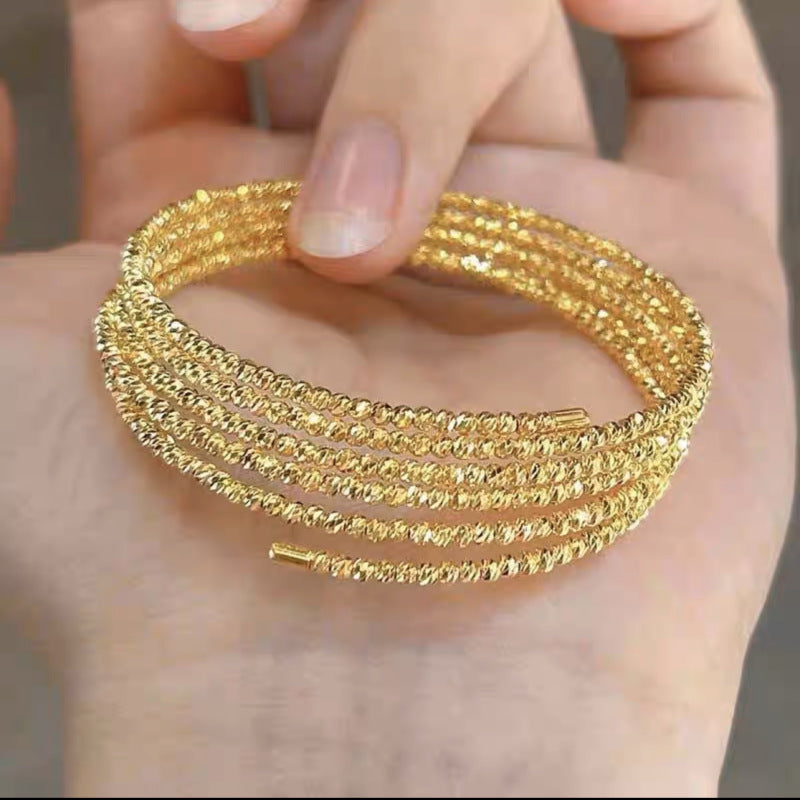 Bracelet flexible multi-anneaux avec perle brillantes